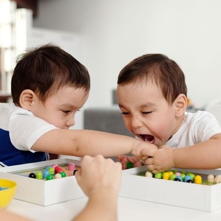 boy almost biting another child