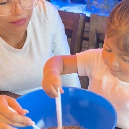 child mixing the materials together