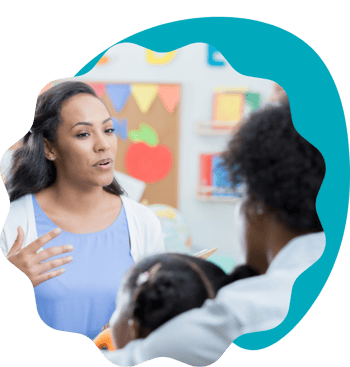 Parent and child talking to teacher