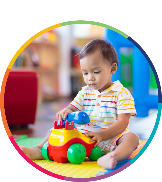 Toddler playing with telephone toy